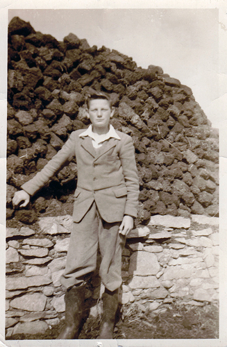 Here I am in Ireland alongside our stack of turf.